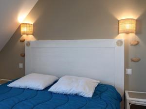 a bedroom with a bed with two pillows on it at T de Pentrez N10 2P4 in Pentrez +4 photos