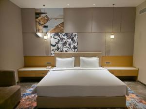 Postel nebo postele na pokoji v ubytování Grand Continent Luxury Collection