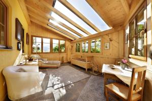 a large living room with a skylight at Baumannhof Mooskofel - adults only in Plazzoles