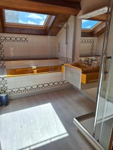 a bathroom with a tub and a sink at Chambres d'hôtes LA CHAPELAINE in La Chapelle-en-Vercors +41 photos