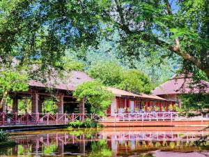 a restaurant on the side of a river at Lâm Viên Hotel & Retreat in Kon Rung (1)