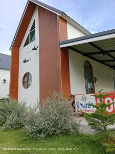 a church with a sign in front of it at The pool villa in Ban Phu Din +5 photos