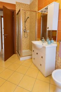 a bathroom with a sink and a shower at Gabry's Holiday Apartment in Ortona