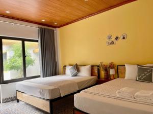 Postel nebo postele na pokoji v ubytování Tam Coc Harmony Homestay