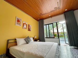 Postel nebo postele na pokoji v ubytování Tam Coc Harmony Homestay