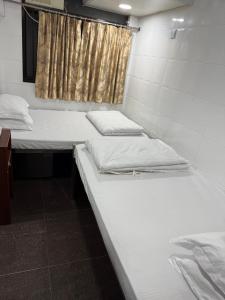 Ένα ή περισσότερα κρεβάτια σε δωμάτιο στο Angel paradise guest house