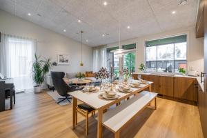 a dining room and kitchen with a table and chairs at Villa Memory-Aurora view bath-Sauna-Lapland-Santa in Rovaniemi
