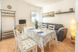 a living room with a table and a couch at Bosmar 1C in Pals +13 photos