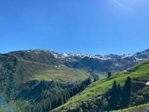 a view of a mountain valley with a road at Chalet in Zillertal near Hochzillertal Ski Area in Zellberg