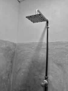 a shower head in the corner of a room at Kurundu House Mirissa in Mirissa +26 photos