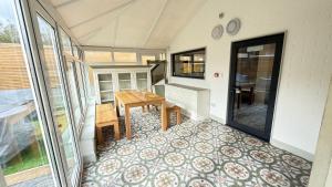 a tiny house with a table and a room at Crystal Palace Stylish Large Ensuite Double Room in Crystal Palace +30 photos