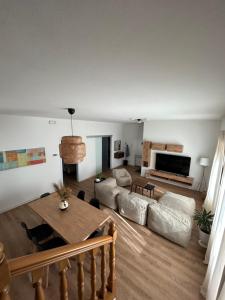 a living room with a couch and a table at Monfalcone Easy Stay WEST in Monfalcone