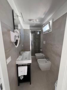 Et badeværelse på ADAGIO by Verde Blu Vacanze