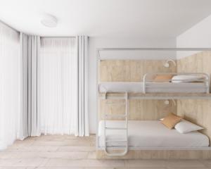 Кровать или кровати в номере Fairschlafen Boutique Hostel Zimmer 0-05