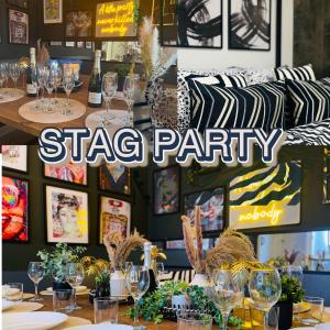 a restaurant with a table with wine glasses on it at Stag Do accommodation, central Bournemouth in Bournemouth