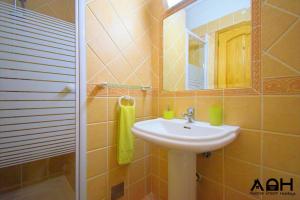 a bathroom with a sink and a mirror at Luz do Sol in Guia