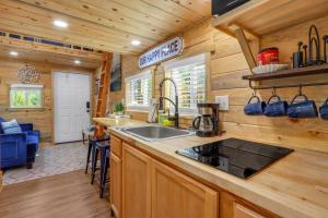 a kitchen with a sink and a counter top at Arbor House of Dripping Springs - Serenity Hollow in Dripping Springs