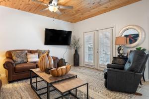 a living room with a couch and a table at Charter Landing A7 in Orange Beach