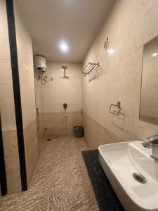 a bathroom with a sink and a toilet in it at Blue Brick in Jodhpur +27 photos