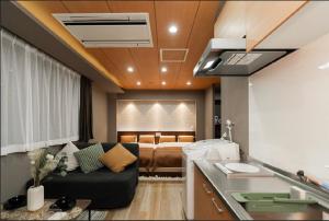 a living room with a couch and a bed at Sunlight Room3-2 in Tokyo +232 photos