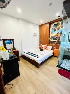 クイニョンにあるHomestay Lumia Goldのベッドルーム1室(ベッド1台付) +52枚の写真