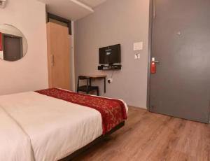 TV a/nebo společenská místnost v ubytování Hotel Travana Stay