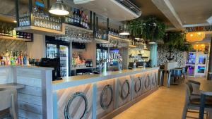 a bar with a lot of bottles of alcohol at TheLeoHome in Selsey