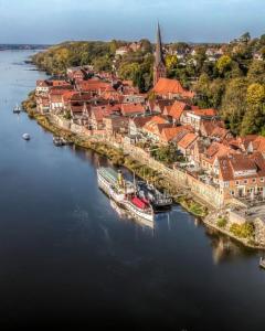 an aerial view of a town on a river at Ferienwohnung ElbGlück in Lauenburg