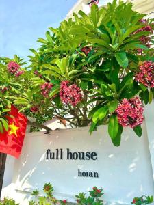 a sign for a full house with a plant at Fullhouse Hoian in Hoi An +43 photos