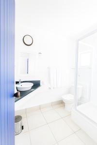 a white bathroom with a sink and a toilet at Kaliva 136 Club Mykonos, Langebaan in Langebaan