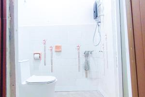 a bathroom with a toilet and a shower at Traditional Cottage at Sunway by HCK in Petaling Jaya +70 photos