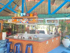 a bar in a restaurant with stools around it at Pirate Galeon Resort in Carcar