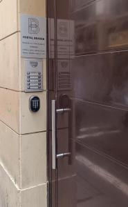 a metal box with a sign on the side of it at Bearan Rooms 2 in Pamplona