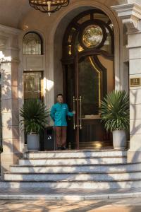 a man standing in the doorway of a building at Proverb Hotel Hanoi in Hanoi +76 photos