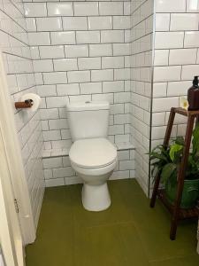 a white bathroom with a toilet in a room at The Sandwich Hideaway in Sandwich +23 photos