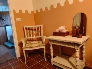 a room with a table and a mirror and a chair at Casa Corral Bouzamayor in Valdoviño +37 photos