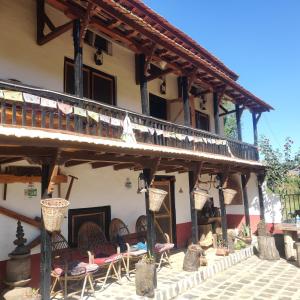 a building with chairs and tables in front of it at Balthali Heritage Inn in Panauti +23 photos