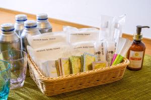 a basket filled with bottles of alcohol on a table at Hotel Mystays Premier Hamamatsucho in Tokyo