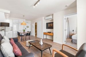 a living room with a couch and a table at Ramada Residences by Wyndham Costa Adeje in Adeje