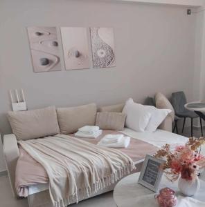 a living room with a couch and speakers on the wall at L28 apartment in Tripoli