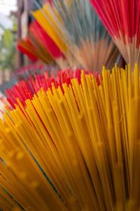 a bunch of colored umbrellas are lined up at Nùng An homestay in Quảng Uyên