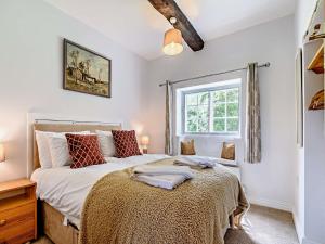 a bedroom with a bed and a window at 8 Bed in Ripon 72263 in Grantley