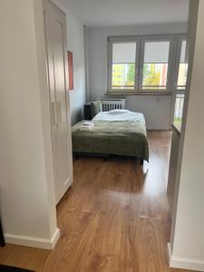 Postel nebo postele na pokoji v ubytování Apartament Matejki