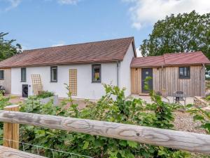 a white house with a wooden fence at 2 Bed in Newent 78696 in Aston Ingham +7 photos
