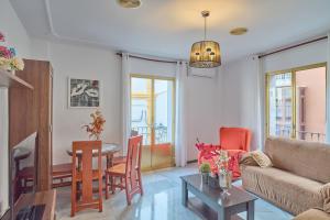 a living room with a couch and a table at Casa Filo Vistas Montaña in Rute