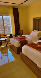 Postel nebo postele na pokoji v ubytování Shaqilath Hotel + 10 fotografií