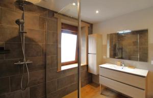 a bathroom with a shower and a sink and a shower at La Clé des Champs à Bussang - Gîte tout confort dans les Hautes Vosges in Bussang +30 photos