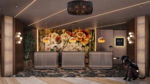 a lobby with chairs and a painting of flowers at NYX Hotel Rome by Leonardo Hotels in Rome