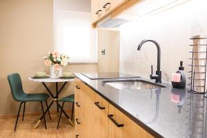 a kitchen with a sink and a small table at versão b in Ansião +62 photos