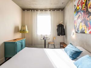 Postel nebo postele na pokoji v ubytování Greet Hotel Limoges Nord